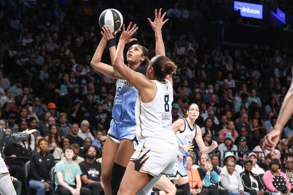 Chicago Sky's Angel Reese shooting over New York Liberty's Nyara Sabally.