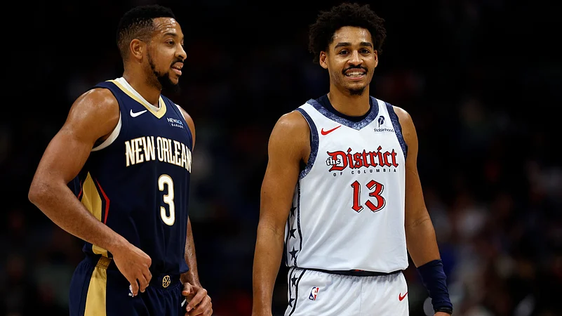 CJ McCollum #3 of the New Orleans Pelicans stands on the court with Jordan Poole