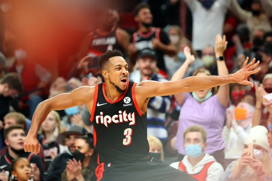 <em>PORTLAND, OREGON – NOVEMBER 15: CJ McCollum #3 of the Portland Trail Blazers celebrates after making a three-point basket against the Toronto Raptors during the fourth quarter at Moda Center on November 15, 2021 in Portland, Oregon. (Photo by Abbie Parr/Getty Images)</em>