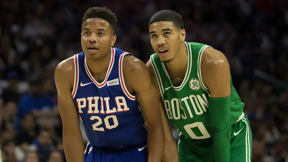 PHILADELPHIA, PA - OCTOBER 20: Markelle Fultz #20 of the Philadelphia 76ers stands next to Jayson Tatum #0 of the Boston Celtics during foul shots in the first half at the Wells Fargo Center on October 20, 2017 in Philadelphia, Pennsylvania. The Celtics defeated the 76ers 102-92. NOTE TO USER: User expressly acknowledges and agrees that, by downloading and or using this photograph, User is consenting to the terms and conditions of the Getty Images License Agreement. (Photo by Mitchell Leff/Getty Images)