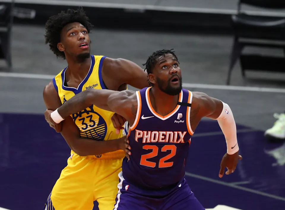 Mar 4, 2021; Phoenix, Arizona, USA; Golden State Warriors center James Wiseman (33) against Phoenix Suns center Deandre Ayton (22) at Phoenix Suns Arena. © Mark J. Rebilas-Imagn Images