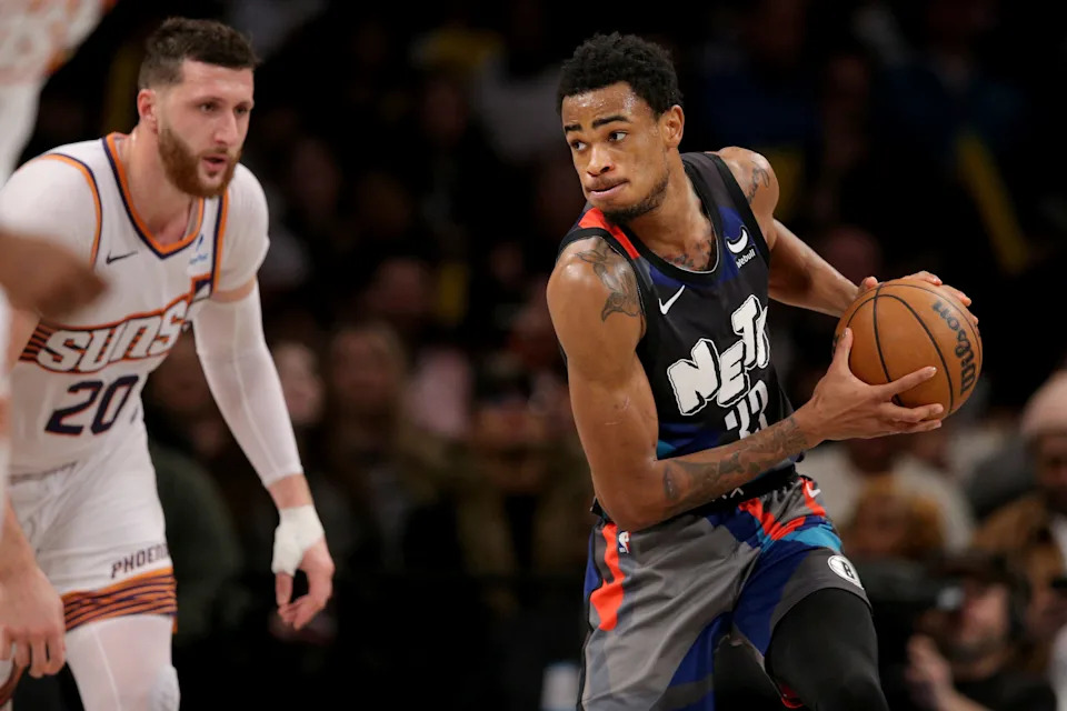 Jan 31, 2024; Brooklyn, New York, USA; Brooklyn Nets center Nic Claxton (33) controls the ball against Phoenix Suns center Jusuf Nurkic (20) during the third quarter at Barclays Center. Mandatory Credit: Brad Penner-USA TODAY Sports