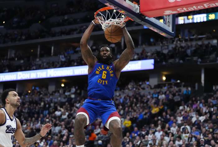 Jan 23, 2025; Denver, Colorado, USA; Denver Nuggets center DeAndre Jordan (6) dunks the ball in the second quarter against the Sacramento Kings at Ball Arena. Mandatory Credit: Ron Chenoy-Imagn Images