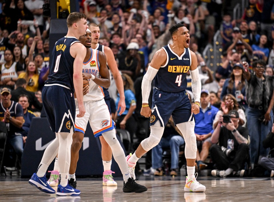 Russell Westbrook of the Denver Nuggets celebrates after a jump ball with Shai Gilgeous-Alexander of the Oklahoma City Thunder.