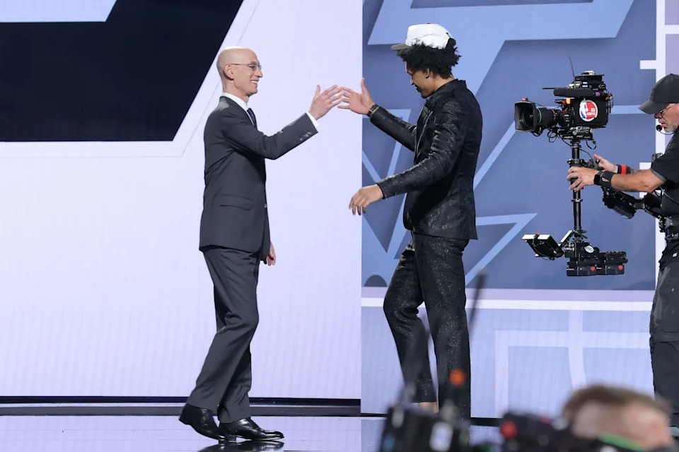 Jun 25, 2025; Brooklyn, NY, USA; Dylan Harper reacts with NBA commissioner Adam Silver after being selected as the second pick by the San Antonio Spurs in the first round of the 2025 NBA Draft at Barclays Center. Mandatory Credit: Brad Penner-Imagn Images