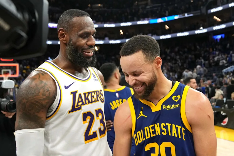 Los Angeles Lakers forward LeBron James (23) and Golden State Warriors guard Stephen Curry (30).Darren Yamashita-USA TODAY Sports
