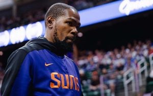 Kevin Durant in an arena with spectators in the background.