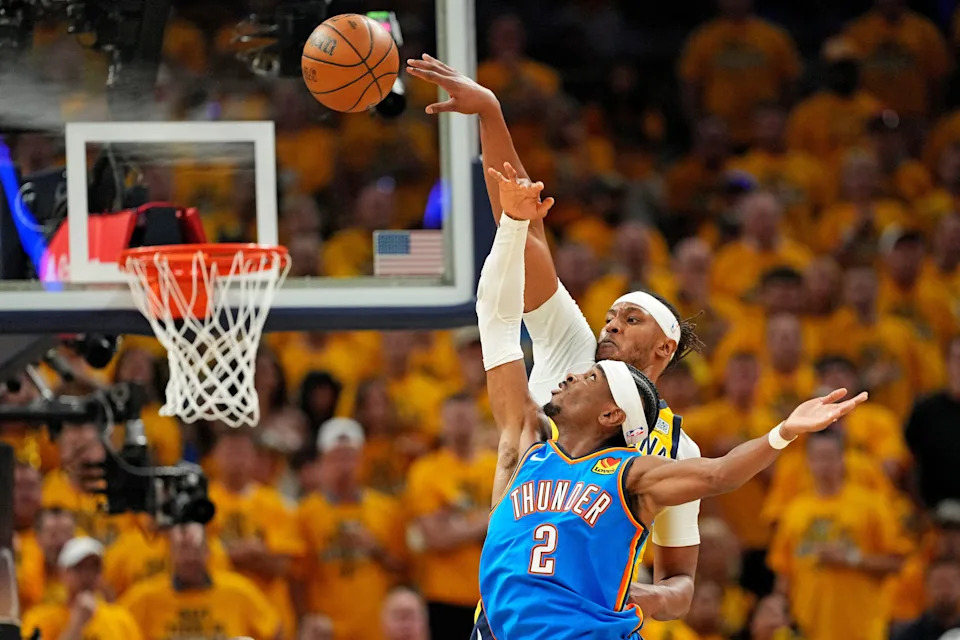 The Indiana Pacers' Myles Turner (33) blocks a shot by Shai Gilgeous-Alexander.