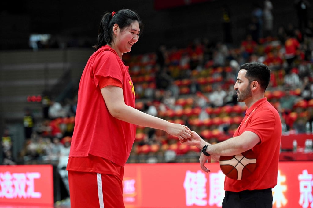 Zhang Ziyu greets an umpire before the match against Japan in Xian. Photo: AFP