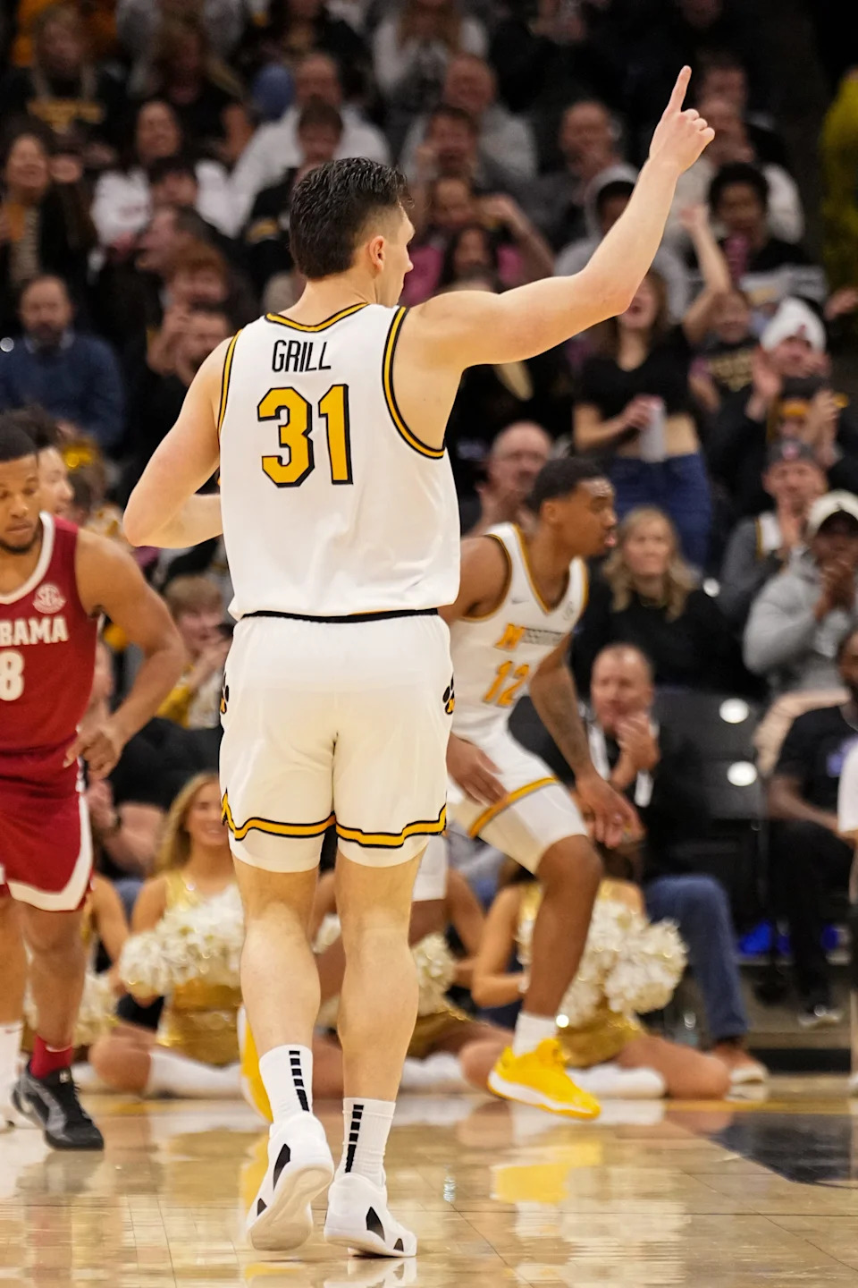 Feb 19, 2025; Columbia, Missouri, USA; Missouri Tigers guard Caleb Grill (31) celebrates after scoring against the Alabama Crimson Tide during the second half at Mizzou Arena. Mandatory Credit: Denny Medley-Imagn Images