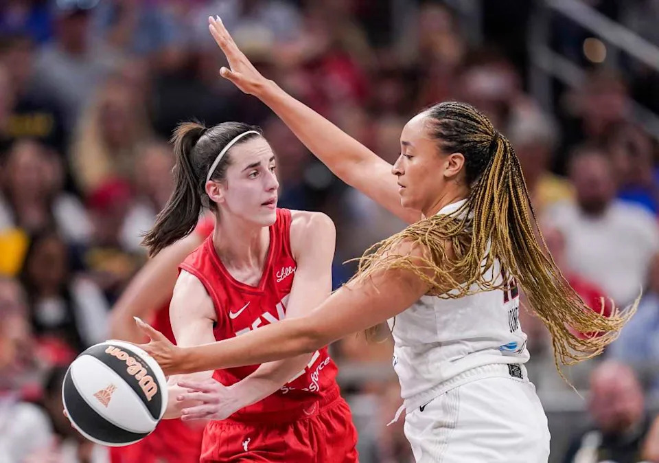 Indiana Fever guard Caitlin Clark (22) passes the ball against Atlanta Dream guard Haley Jones (13).Grace Hollars/IndyStar / USA TODAY NETWORK via Imagn Images