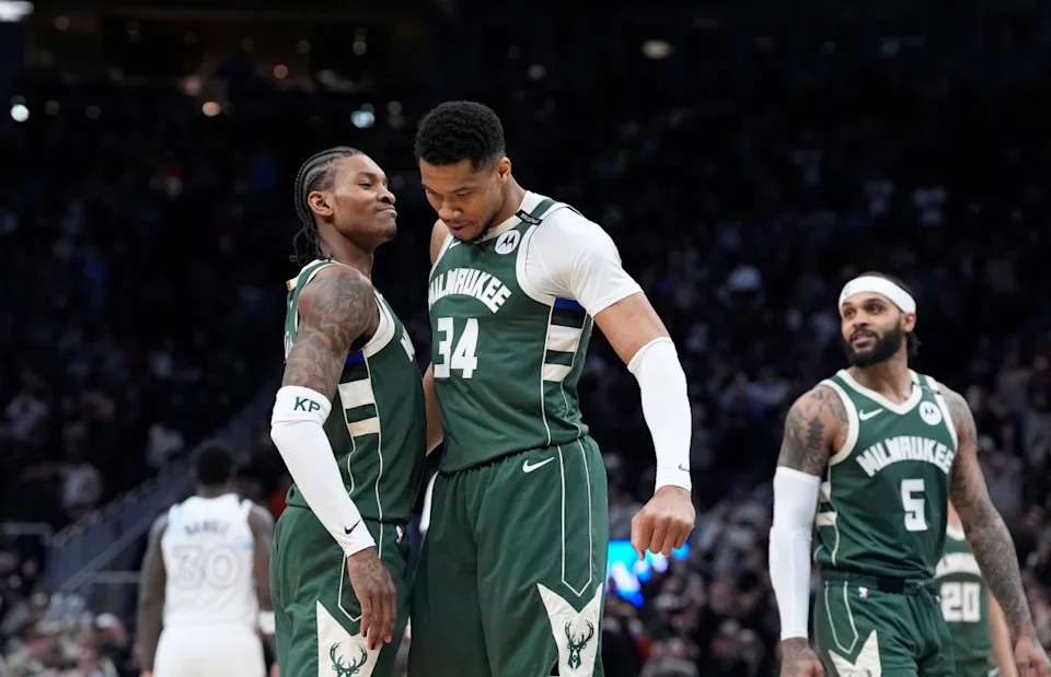 Milwaukee Bucks guard Kevin Porter Jr. and Milwaukee Bucks forward Giannis Antetokounmpo celebrate as the clock winds down in their 110-103 comeback victory over the Minnesota Timberwolves at Fiserv Forum.Michael McLoone-Imagn Images