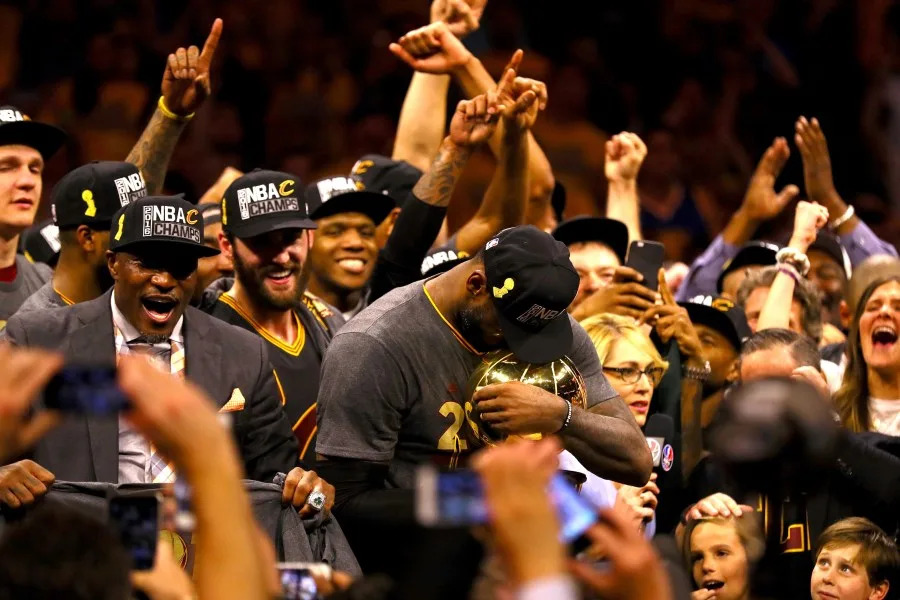 OAKLAND, CA – JUNE 19: LeBron James #23 of the Cleveland Cavaliers holds the Larry O’Brien Championship Trophy after defeating the Golden State Warriors 93-89 in Game 7 of the 2016 NBA Finals at ORACLE Arena on June 19, 2016 in Oakland, California. NOTE TO USER: User expressly acknowledges and agrees that, by downloading and or using this photograph, User is consenting to the terms and conditions of the Getty Images License Agreement. (Photo by Ezra Shaw/Getty Images)