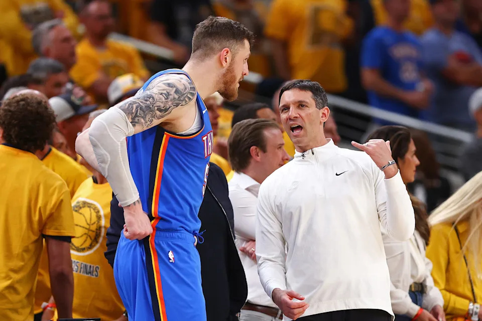 INDIANAPOLIS, INDIANA - JUNE 13: Head coach Mark Daigneault and Isaiah Hartenstein #55 of the Oklahoma City Thunder cpeak during the third quarter against the Indiana Pacers in Game Four of the 2025 NBA Finals at Gainbridge Fieldhouse on June 13, 2025 in Indianapolis, Indiana.