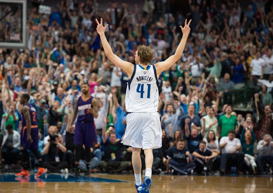 Dallas Mavericks forward Dirk Nowitzki (41) celebrates his three point basket against the Phoenix Suns during final minute of second half at the American Airlines Center.© Jerome Miron-Imagn Images