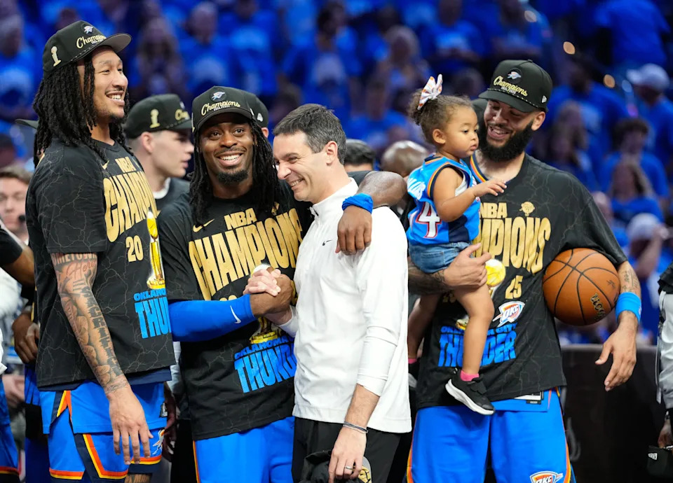 Jun 22, 2025; Oklahoma City, Oklahoma, USA; Oklahoma City Thunder guard Luguentz Dort (5) with head coach Mark Daigneault after winning game seven of the 2025 NBA Finals against the Indiana Pacers at Paycom Center. Mandatory Credit: Kyle Terada-Imagn Images