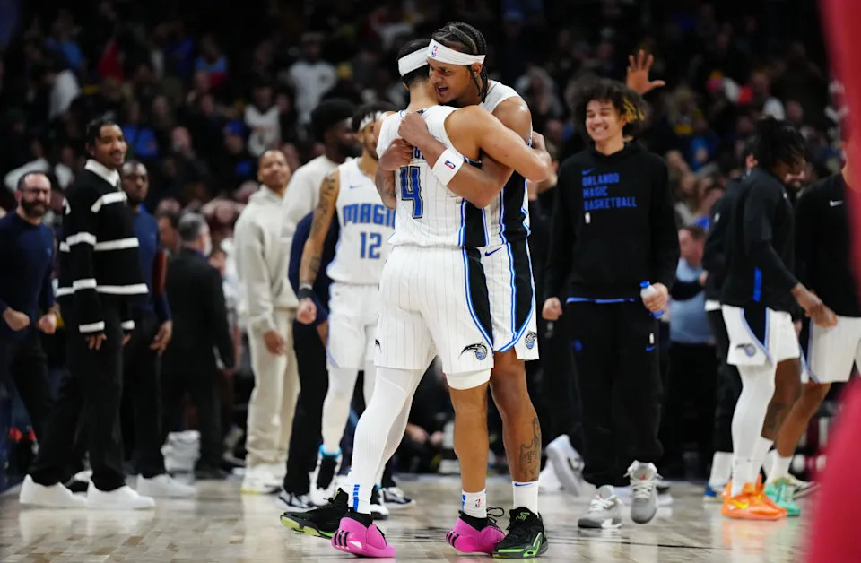 Orlando Magic guard Jalen Suggs and forward Paolo Banchero celebrate defeating the Denver Nuggets at Ball Arena.Ron Chenoy-Imagn Images