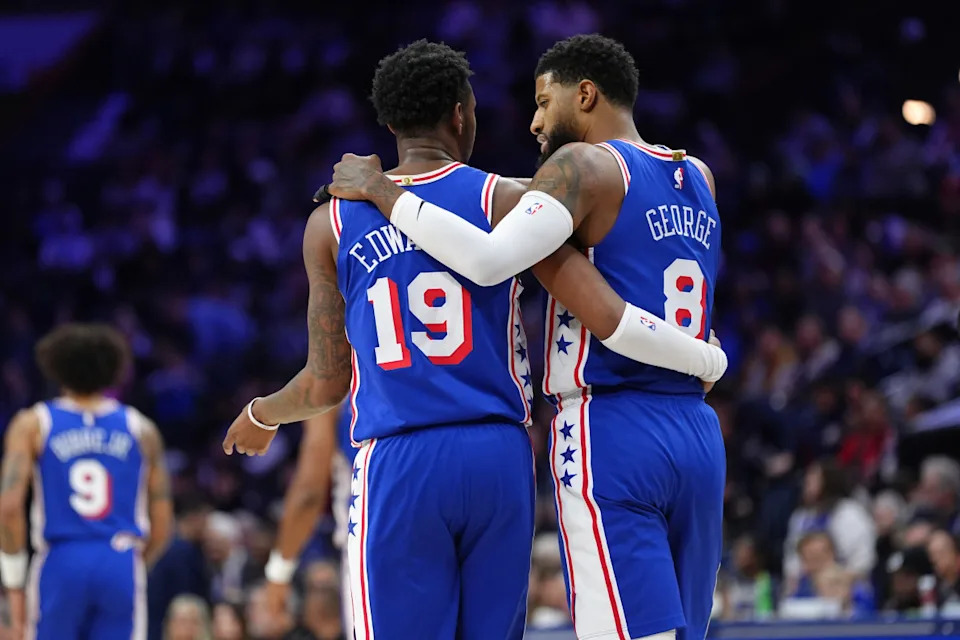 Philadelphia 76ers forward Justin Edwards (19) reacts with forward Paul George (8) against the Miami Heat in the second quarter at Wells Fargo Center.Kyle Ross-Imagn Images