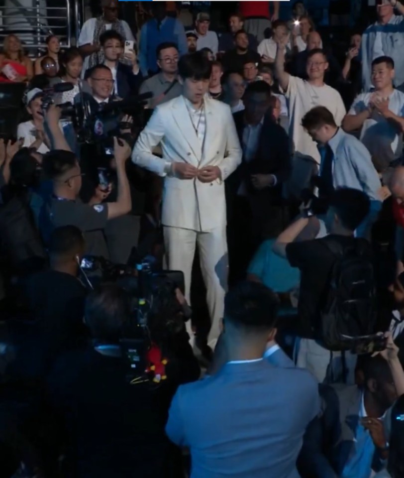 He was sat in the crowd with fans instead of on the front row or in the green room