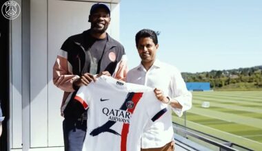 Kevin Durant poses with a PSG uniform...