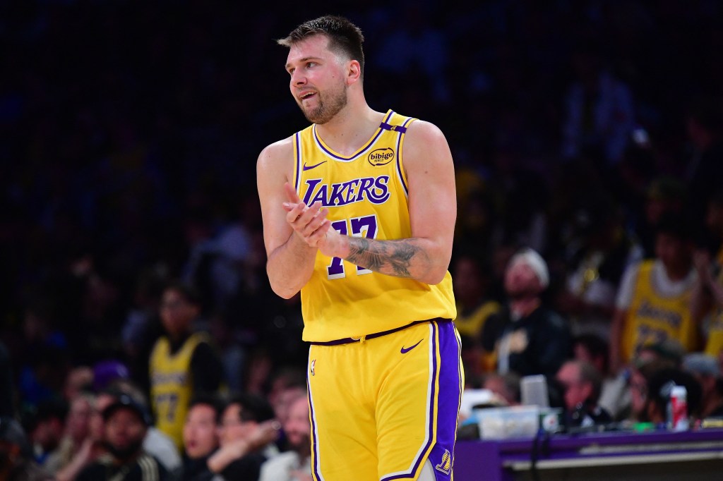 Los Angeles Lakers player Luka Dončić clapping during a game.
