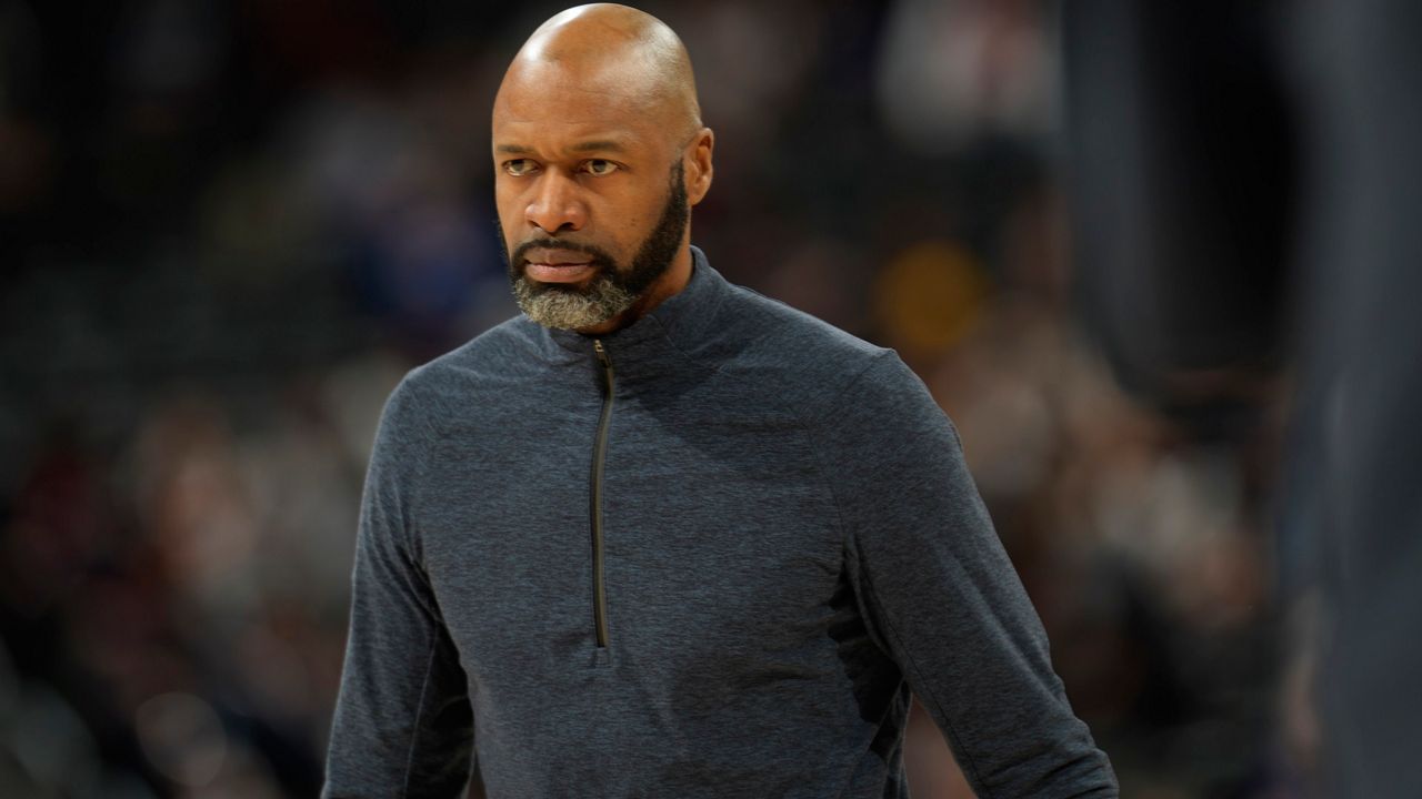Orlando Magic head coach Jamahl Mosley () in the second half of an NBA basketball game Monday, Feb. 14, 2022, in Denver. The Nuggets won 121-111. (AP Photo/David Zalubowski)