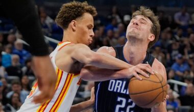 Atlanta Hawks guard Dyson Daniels, left, fouls Orlando Magic forward Franz Wagner (22) as he attempts a shot during the second half of an NBA basketball game, Tuesday, April 8, 2025, in Orlando, Fla. (AP Photo/John Raoux)