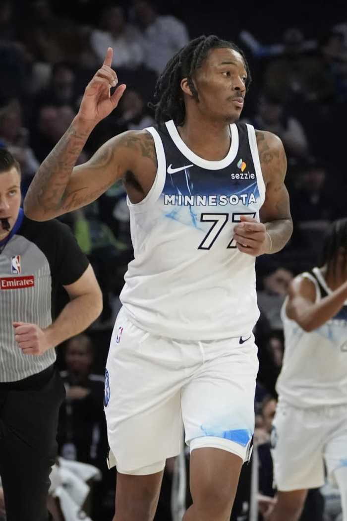 Mar 21, 2025; Minneapolis, Minnesota, USA; Minnesota Timberwolves guard Bones Hyland (77) celebrates his basket against the New Orleans Pelicans in the fourth quarter at Target Center. Mandatory Credit: Bruce Kluckhohn-Imagn Images 