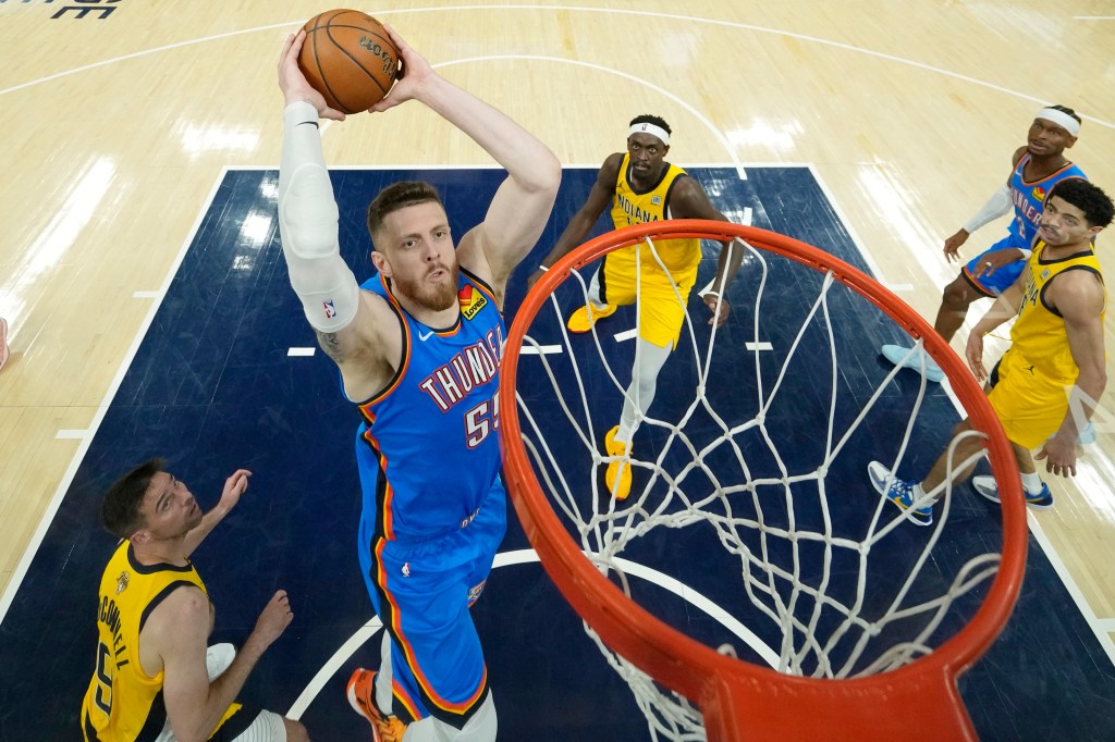 Isaiah Hartenstein of the Oklahoma City Thunder dunking during an NBA Finals game.