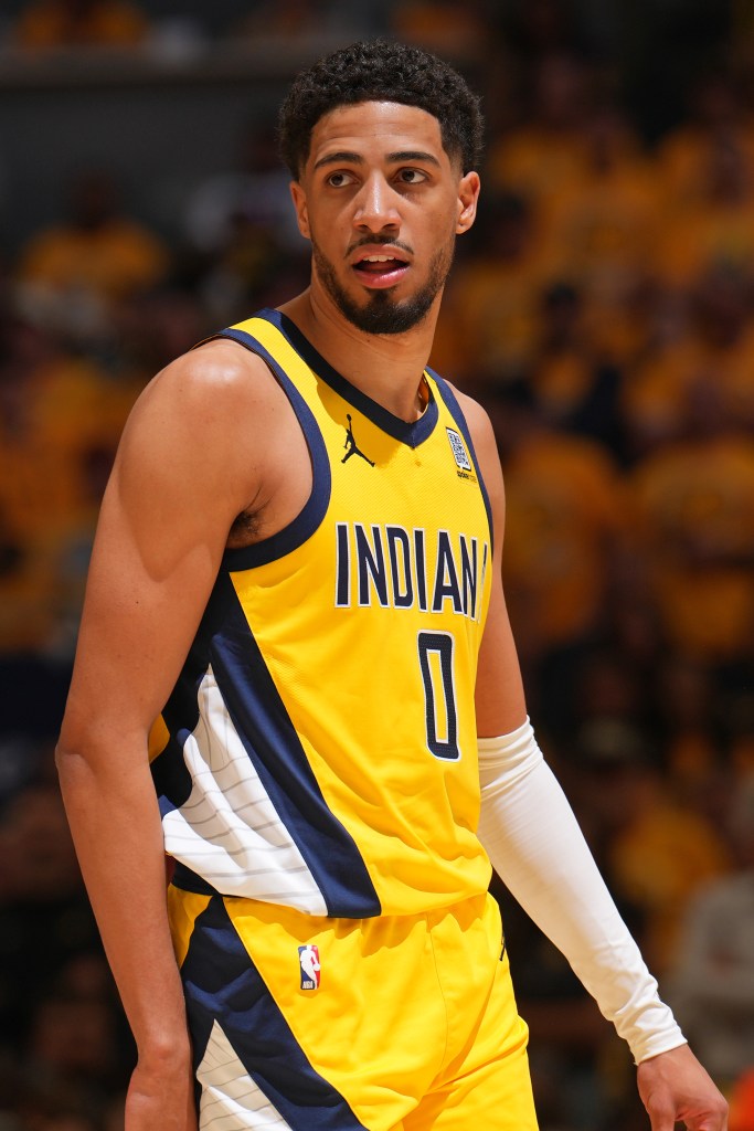 Indiana Pacers player wearing a yellow jersey.