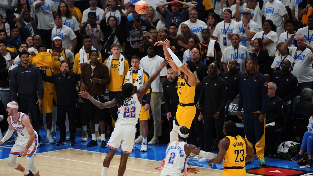 Pacers guard Tyrese Haliburton (0) shoots the game winning basket over Oklahoma City Thunder guard Cason Wallace (22) in the closing second of the second half of Game 1 of the NBA Finals basketball series Thursday, June 5, 2025, in Oklahoma City. (AP Photo/Nate Billings)