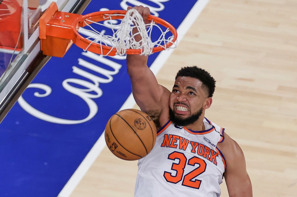 Karl-Anthony Towns #32 of the New York Knicks dunking a basketball.