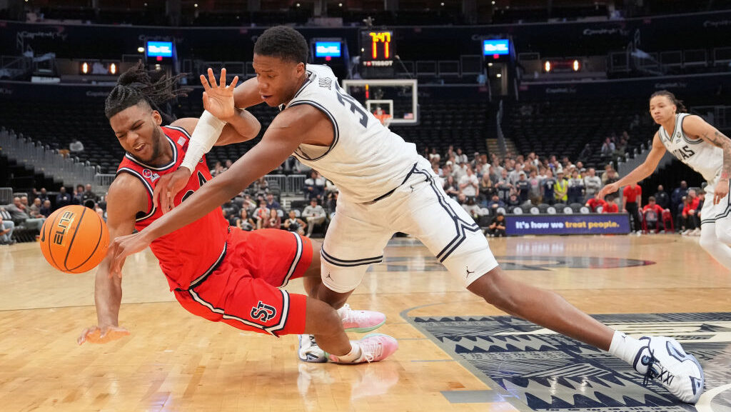 Zuby Ejiofor #24 of the St. John's Red Storm and Thomas Sorber #35 of the Georgetown Hoyas