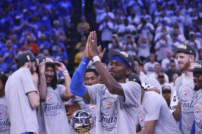 Oklahoma City Thunder guard Shai Gilgeous-Alexander (2), front, celebrates with teammates after Game 5 of the Western Conference finals of the NBA basketball playoffs against the Minnesota Timberwolves, Wednesday, May 28, 2025, in Oklahoma City.
