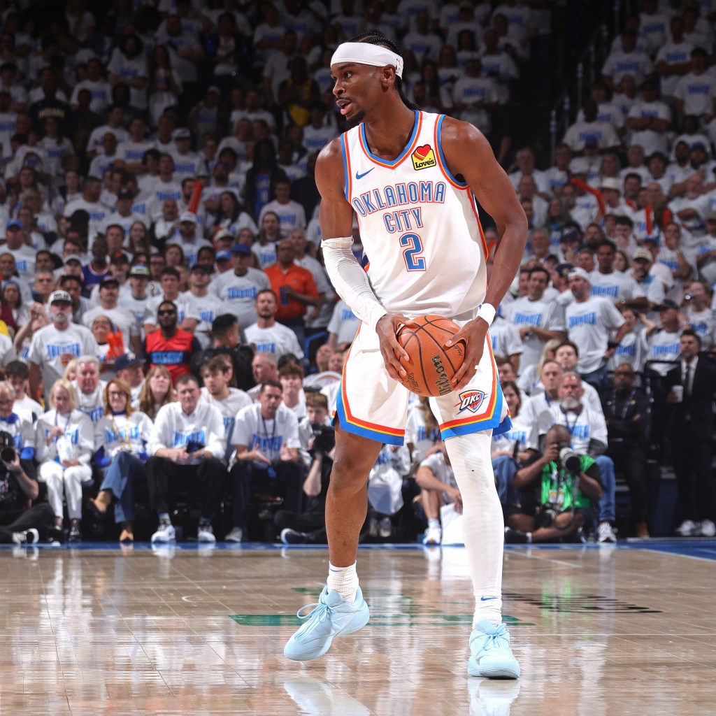 Oklahoma City Thunder player dribbling a basketball.