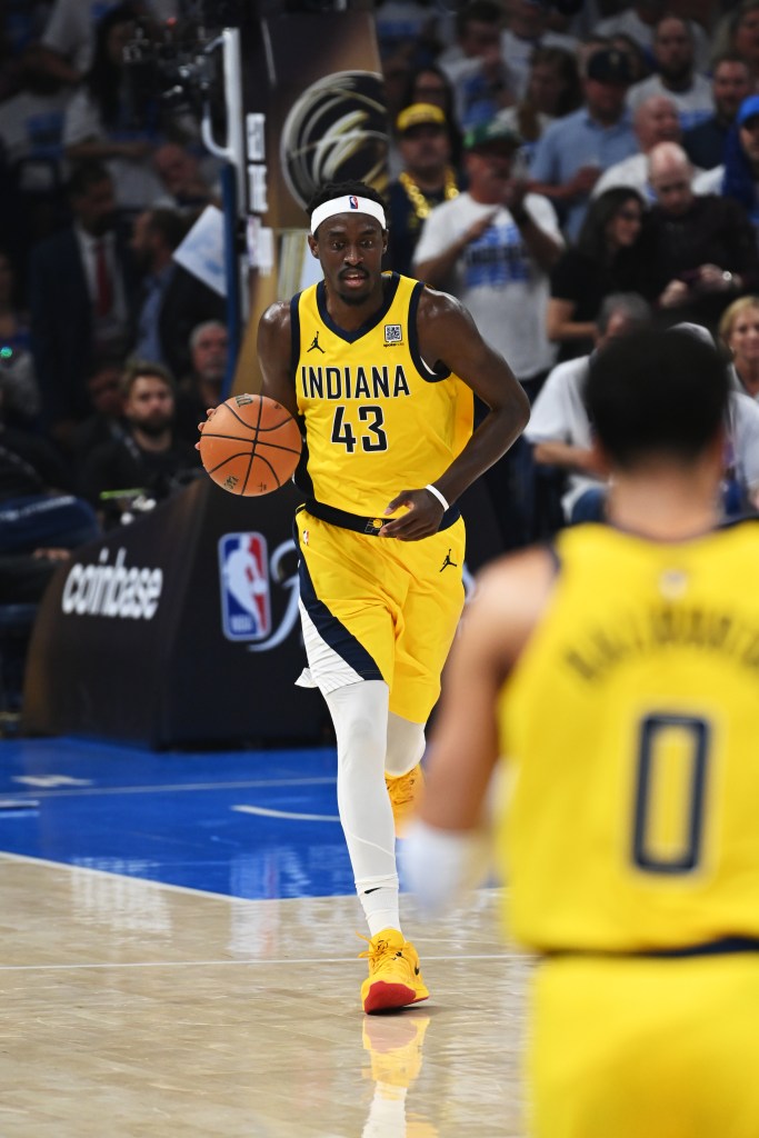Indiana Pacers player dribbling the ball during a game.