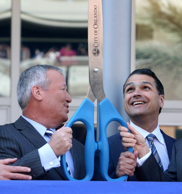 2010: Orlando mayor Buddy Dyer, left, and Orlando Magic president...