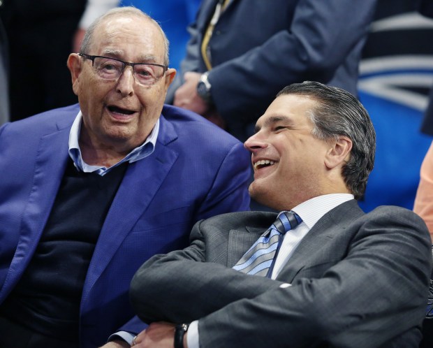 2017: Orlando Magic owner Rich DeVos, left, shares a light...