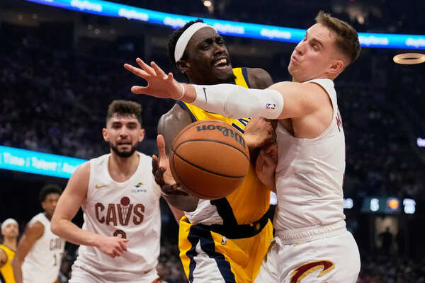 Indiana Pacers forward Pascal Siakam, center, is fouled by Cleveland Cavaliers guard Sam Merrill, right, in the first half during Game 1 in the Eastern Conference semifinals of the NBA basketball playoffs Sunday, May 4, 2025, in Cleveland. (AP Photo/Sue Ogrocki) Tyrese Haliburton ignites closing run for Pacers, who stun Cavs 121-112 in Game 1 of East semis