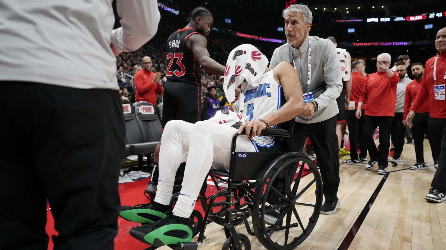 Magic's Jalen Suggs leaves game against Raptors in wheelchair because of back spasms