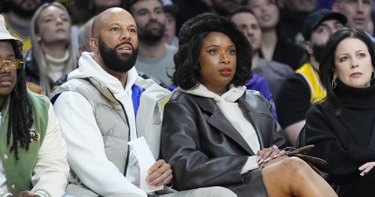 Jennifer Hudson takes one in the face, courtside with Common