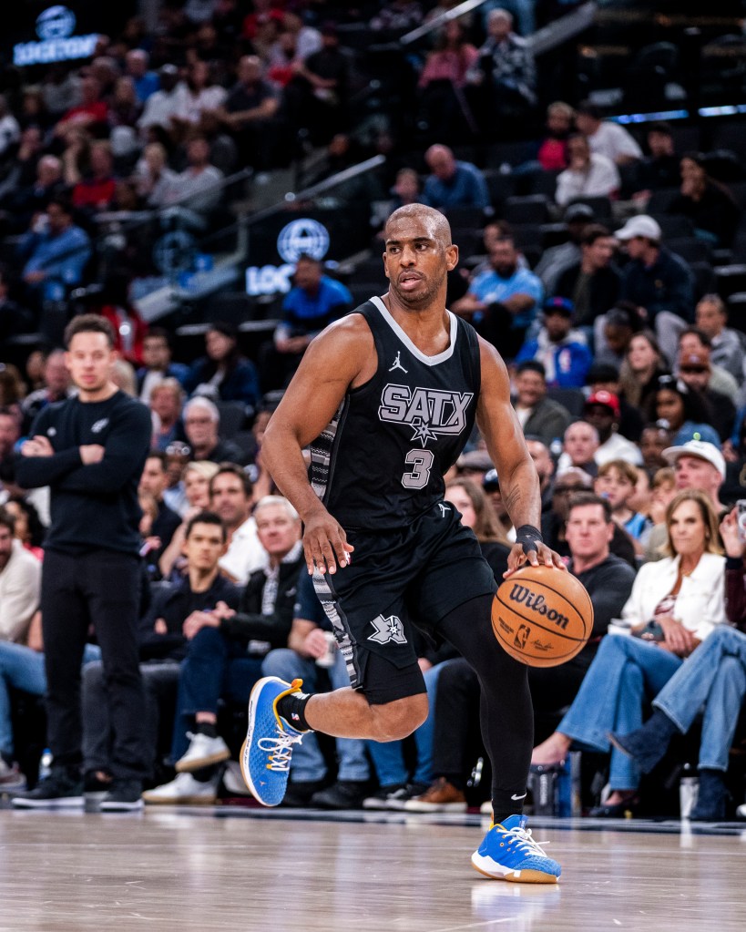 Chris Paul #3 of the San Antonio Spurs dribbling the ball during a game.