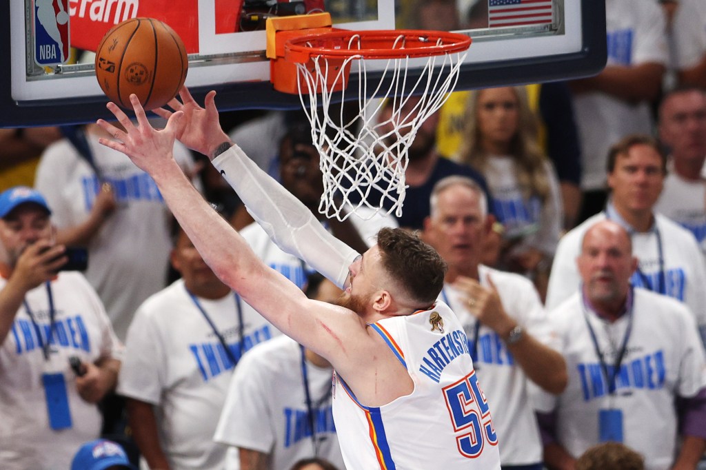 Isaiah Hartenstein grabs a rebound during the Thunder's Game 1 loss to the Pacers on June 5, 2025.