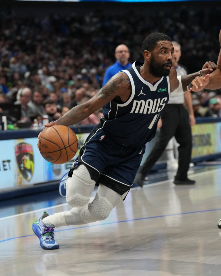 Kyrie Irving #11 of the Dallas Mavericks dribbling the ball.