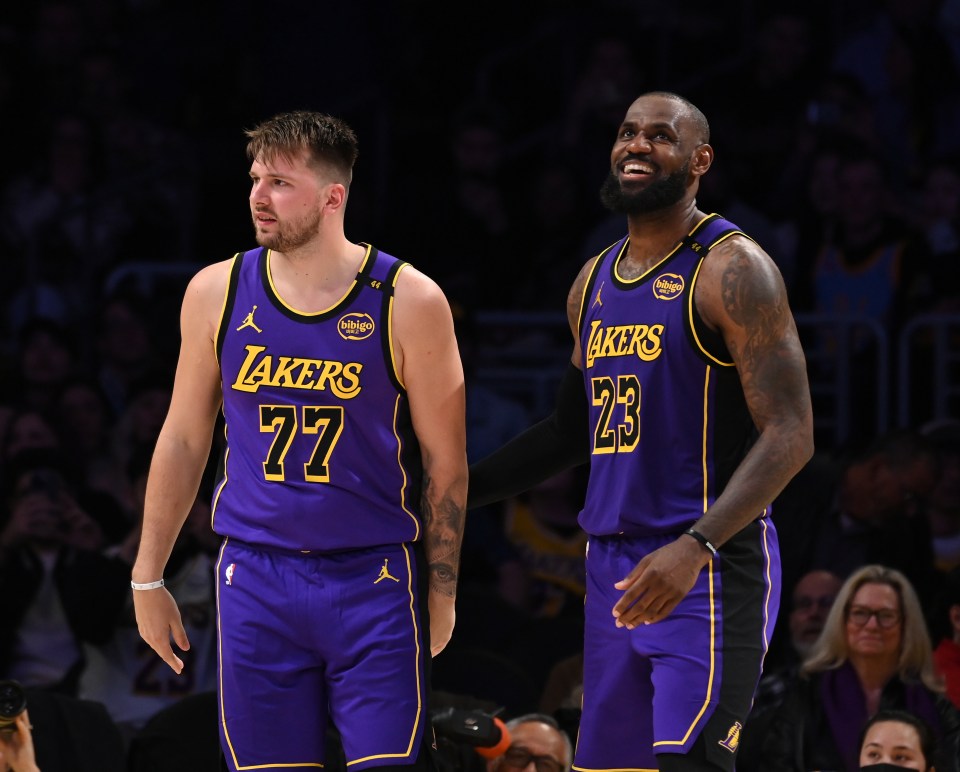Luka Dončić #77 and LeBron James #23 of the Los Angeles Lakers.