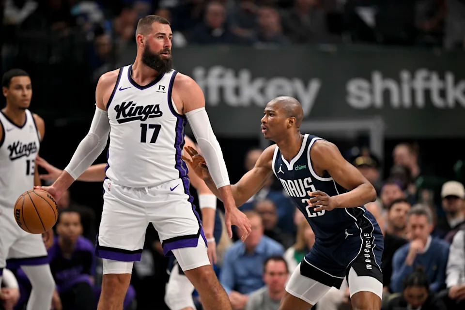 Mar 3, 2025; Dallas, Texas, USA; Sacramento Kings center Jonas Valanciunas (17) looks to move the ball past Dallas Mavericks forward Kai Jones (23) during the first quarter at the American Airlines Center.© Jerome Miron-Imagn Images