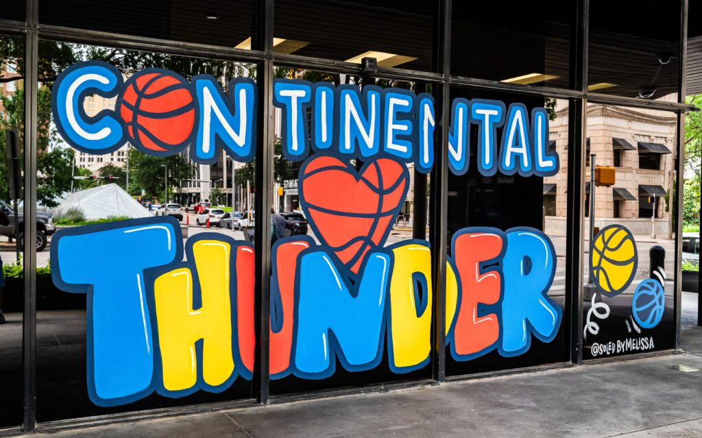 Melissa Griggs-Hendricks' artwork is featured on a Continental Resources window. (Photo by Michael Kinney, The Journal Record)