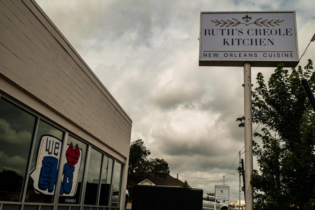 Ruth's Creole Kitchen in Oklahoma City features Melissa Griggs-Hendricks' Thunder-inspired artwork in a window. (Photo by Michael Kinney, The Journal Record)