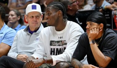 Utah Jazz CEO Danny Ainge and Taylor Hendricks talk as they and Keyonte George watch the Utah Jazz ...