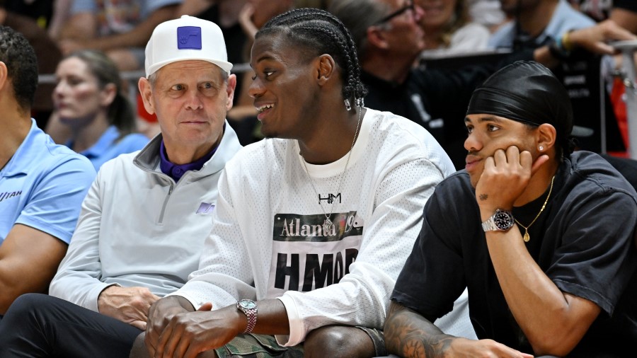 Utah Jazz CEO Danny Ainge and Taylor Hendricks talk as they and Keyonte George watch the Utah Jazz ...